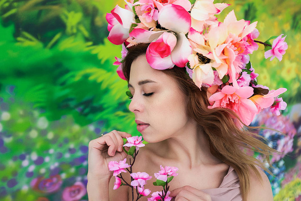 Gentle spring portrait of a girl with flowers, dreams - Fotoğraf, Görsel