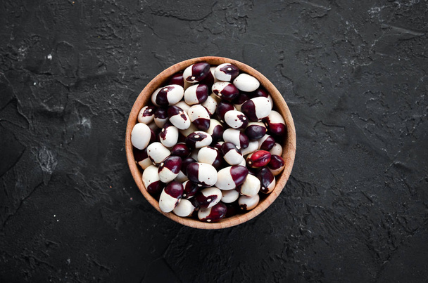 Raw beans in a bowl. Top view. Free copy space. - Foto, Bild