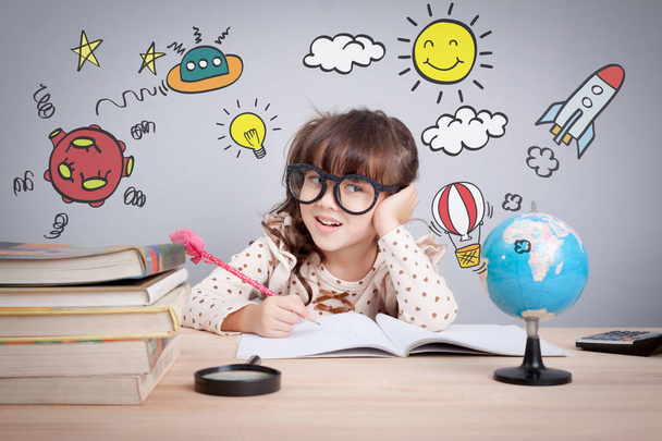 education concept , cute little happy girl at school making homework with creativity - Valokuva, kuva