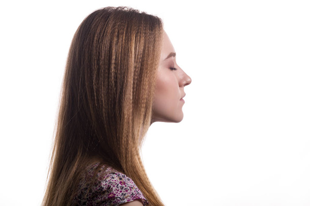 Portrait of a young beautiful woman in profile. - Photo, Image