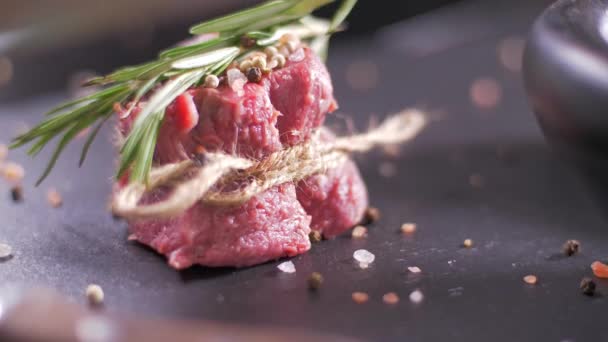 Raw beef steak tied with twine. Preparing filet mignon - Filmati, video