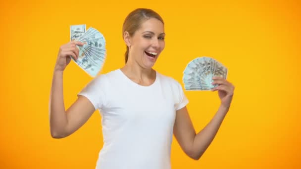 Positive young female dancing with dollars in hand, wealth excitement, lottery - Filmmaterial, Video