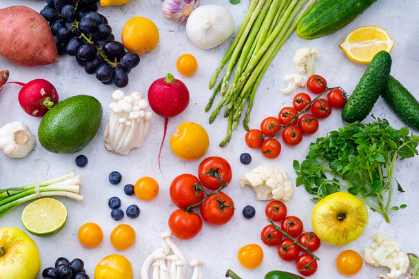 set of colorful fresh vegetables on concrete background. Summer food ingredients concept, top view  - Foto, Bild