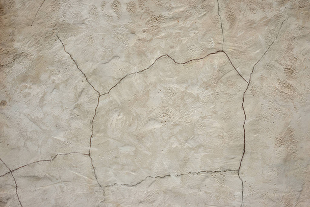 Old rough gray wall with a crack on plaster.  Structured Grunge  - Photo, Image