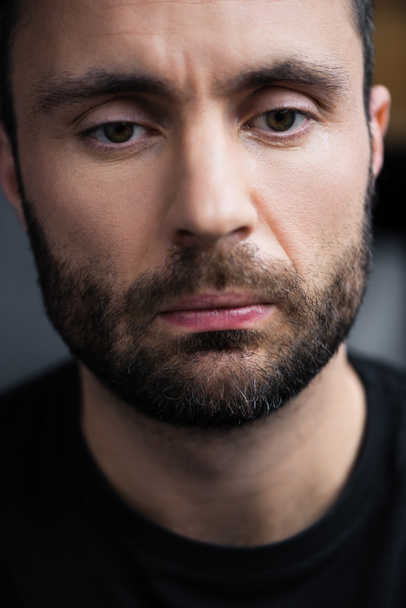 portrait of frustrated, depressed handsome bearded man looking down - Fotoğraf, Görsel