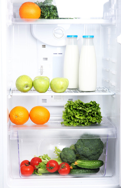 Open refrigerator with vegetarian food - Fotó, kép