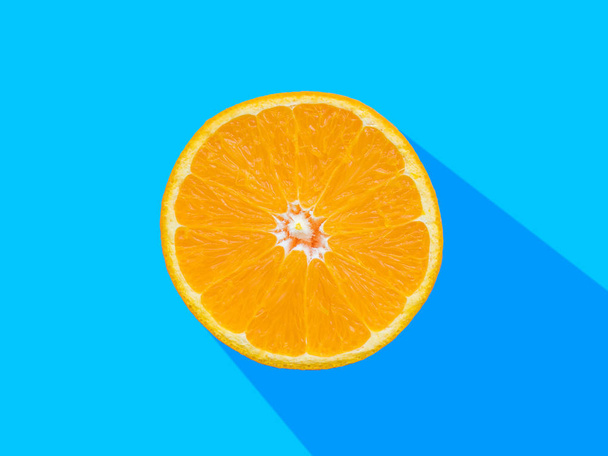 Fresh orange slices patterned over blue background, top view - 写真・画像