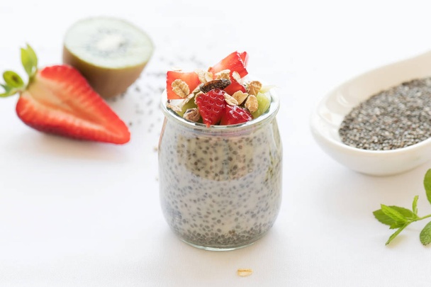 Healthy vegan chia pudding in a jar with fresh berries - Photo, image