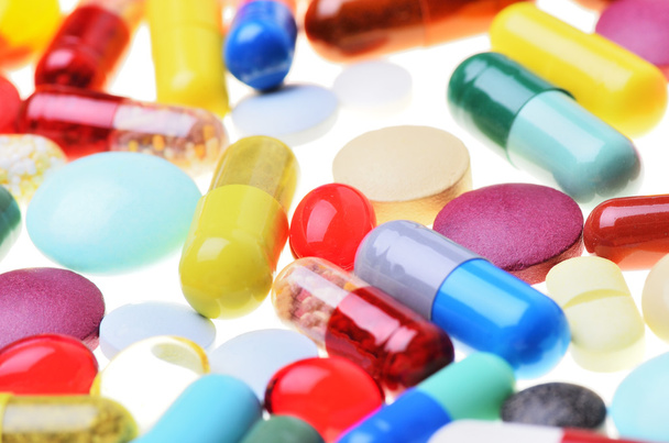 Many colorful pills isolated on white - Valokuva, kuva