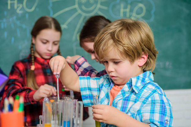 Practical knowledge. Child care and development. School classes. Kids adorable friends having fun in school. School chemistry lab concept. Experimenting together. Supportive environment explore STEM - Photo, image