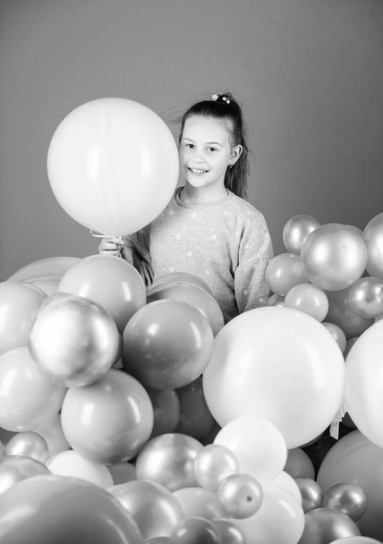 The happiest holiday. Small child. Adorable child with helium balloons. Cute little child with air balloons. Girl child celebrating on birthday - Fotografie, Obrázek
