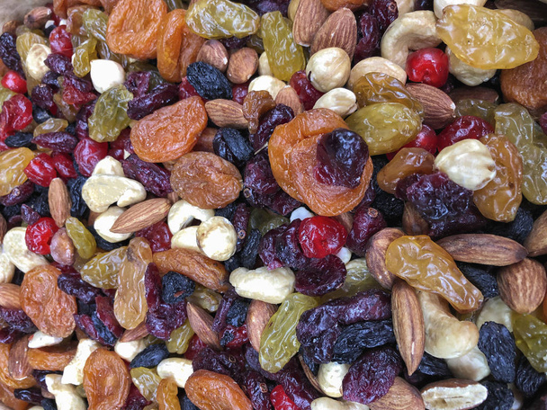 різноманітність сушених фруктів і горіхів як фон
 - Фото, зображення