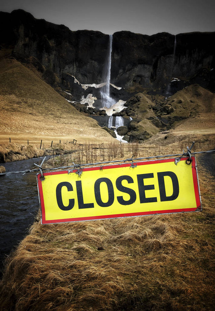 a closed sign against a waterfall in Iceland - Photo, Image