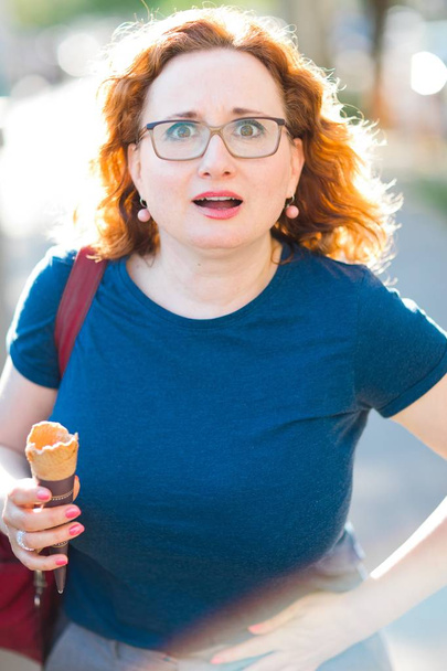 Woman eating ice cream feeling sudden stomach ache. - Фото, зображення