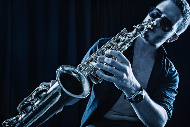 Young man playing the Saxophone. - Foto, Imagem