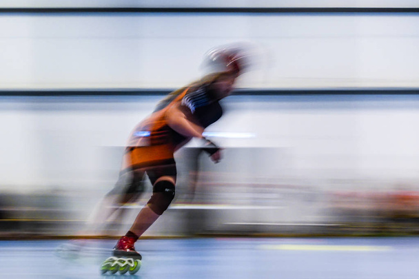 Hjorring, Denmark A rollerblade speed racing competition at the local sports hall. - Photo, Image
