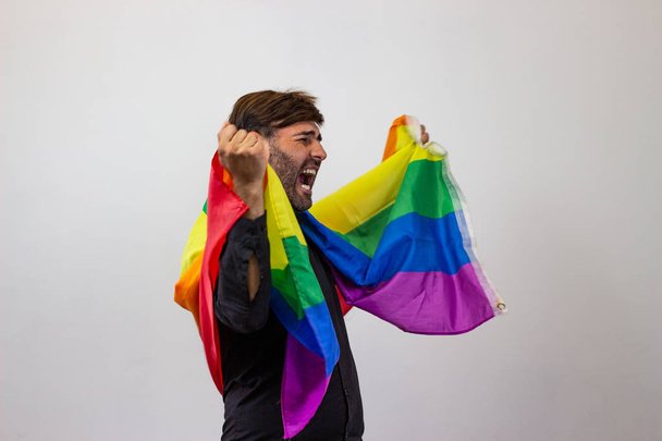 Portrait of handsome young man with gay pride movement LGBT Rain - Foto, afbeelding