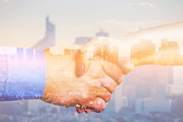 Partners shaking hands with multiple exposure. Global business concept - Photo, Image