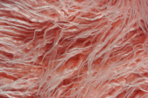 Texture de fourrure rose. Fond abstrait rose. Fausse fourrure rose pâle comme peau mérinos
. - Photo, image