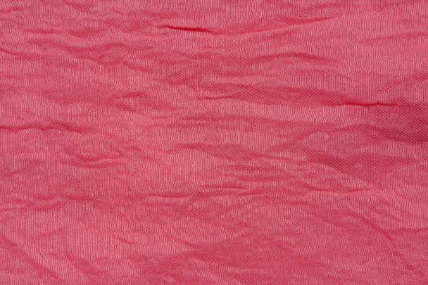 Texture of pink fabric. Pink abstract background. Light pink fabric closeup. - Photo, Image