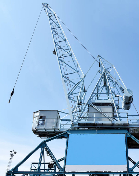 Harbour crane on which an empty advertising poster is attached for self-labelling - Photo, Image