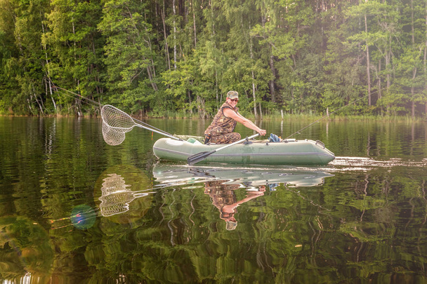 Fischer in einem Boot - Foto, Bild