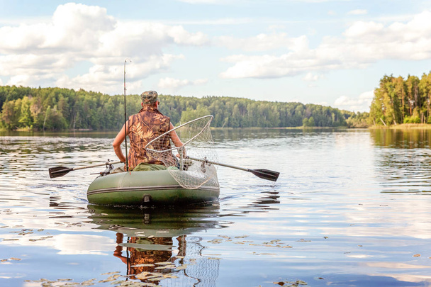 Fisherman in a boat - Photo, Image