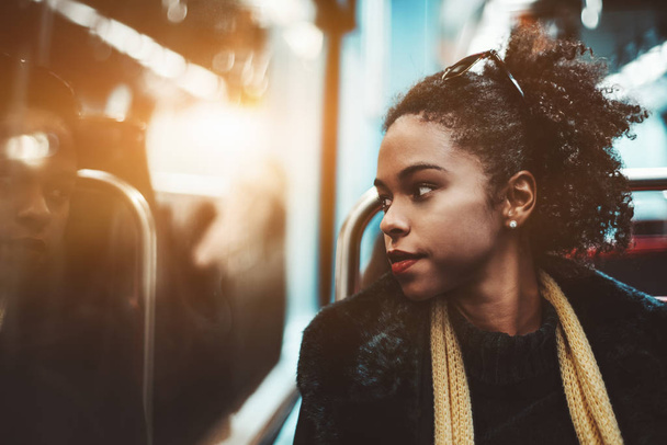 Biracial girl in a subway train - Fotoğraf, Görsel