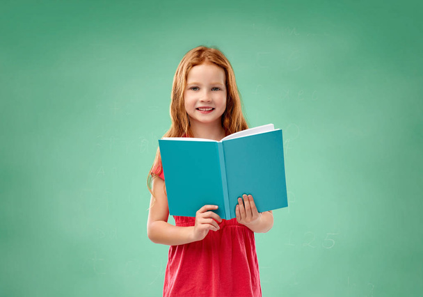 red student girl with book over school chalk board - Φωτογραφία, εικόνα