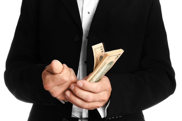 Business man holding money on white background - Fotografie, Obrázek