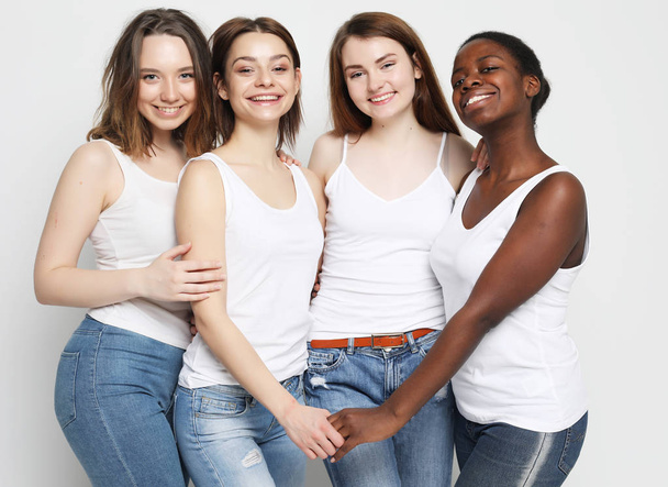 group of four girls friends of different nationalities - Photo, Image
