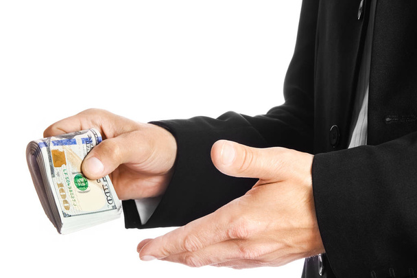 Business man holding money on white background - Фото, зображення
