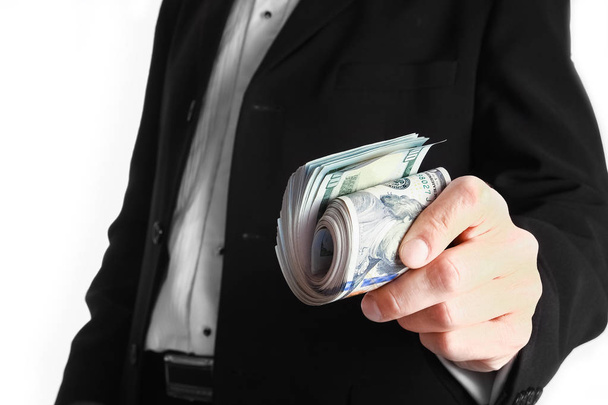 Business man holding money on white background - Zdjęcie, obraz