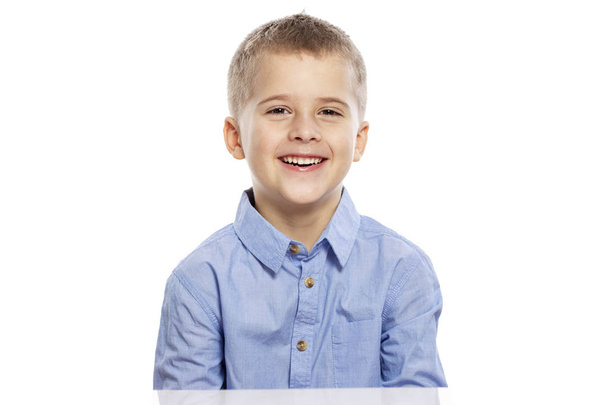 Cute boy laughs. Close-up. Isolated on white background. - 写真・画像