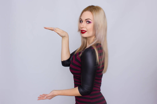 Blonde woman in red and black dress - Foto, immagini