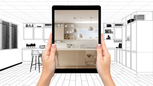 Kädet tilalla tabletti osoittaa moderni valkoinen ja puinen keittiö. Suunnitelma CAD luonnos tausta, täydennetty todellisuus käsite, sovellus simuloida huonekaluja ja sisustustuotteita
 - Valokuva, kuva