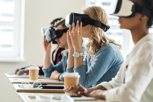 selective focus of multiethnic students using vr headsets in university - Photo, Image