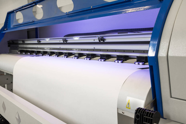 Blank paper roll in large printer format inkjet machine for industrial business. - Photo, Image