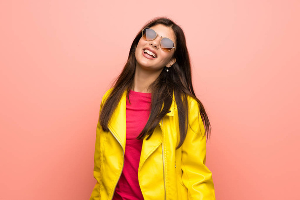 Teenager girl over pink wall with glasses and happy - Photo, Image