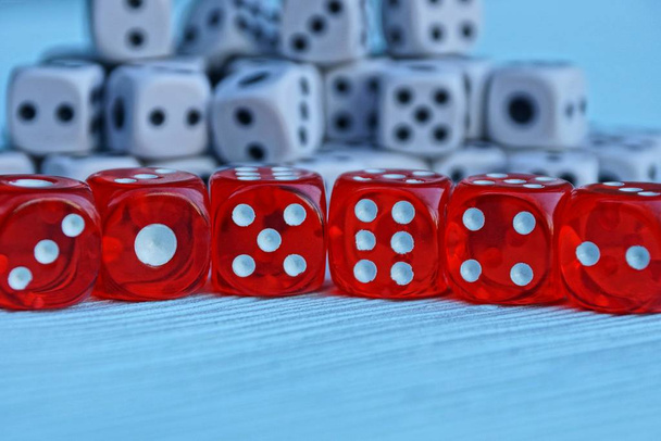 row of red dice on the background of small white cubes - Photo, Image