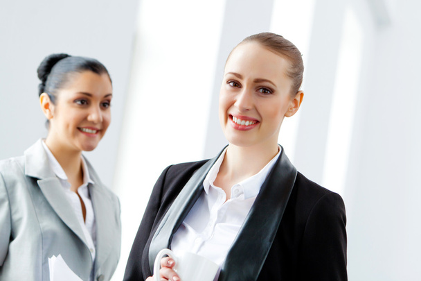 Two attractive business women smiling - Photo, Image