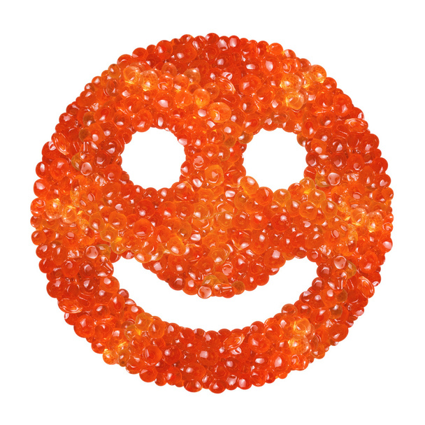 Red caviar in the form of a smile on a white background - Photo, Image
