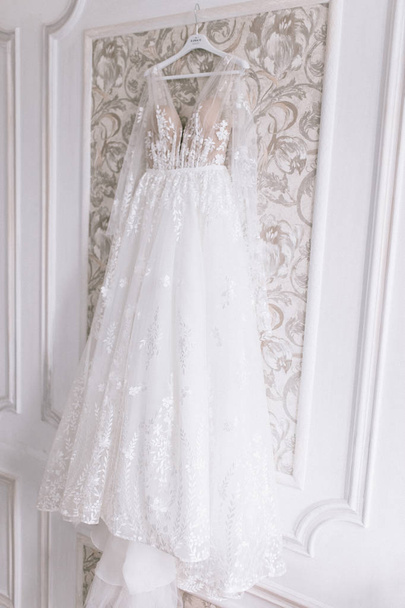 The bride's dress hangs - Фото, изображение