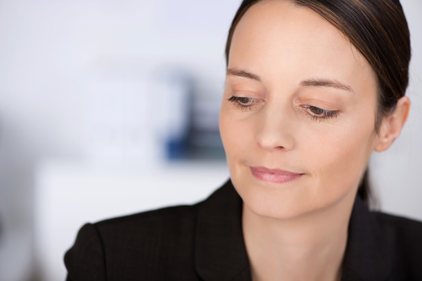 Confident Businesswoman Looking Down In Office - Photo, Image