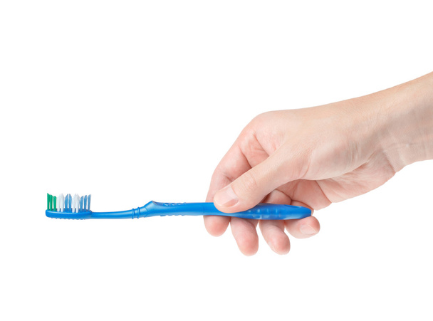 οδοντόβουρτσα σε ένα αρσενικό χέρι - Φωτογραφία, εικόνα