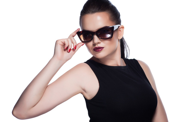 Portrait of beautiful and fashion girl in sunglasses, studio shot - Photo, Image
