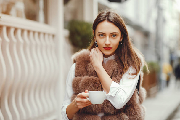 Beautiful girl drinks coffee  - Fotografie, Obrázek