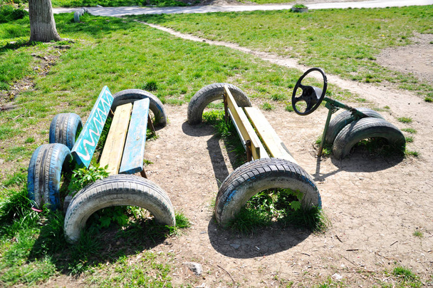  car tires in the ground toy car - Photo, Image