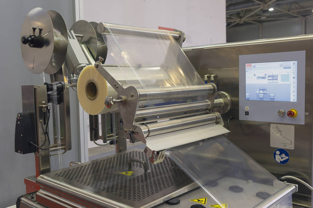 Machine for packing food products close-up. Industry - Photo, Image
