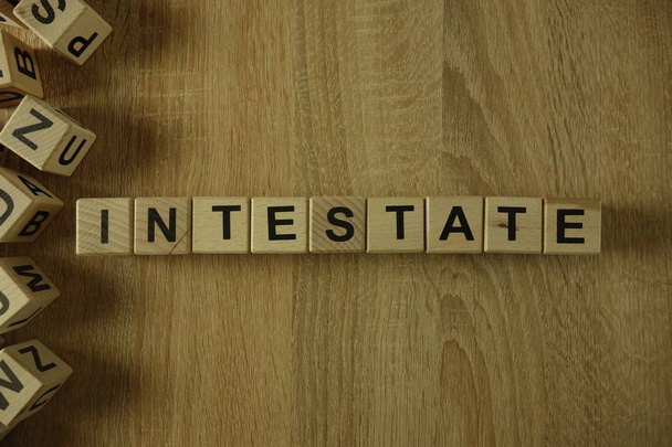 Intestate word from wooden blocks on desk - Photo, Image